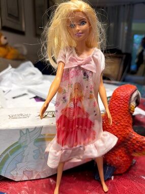 Barbie Mattel Barbie doll wearing a nightgown featuring a printed graphic of a B